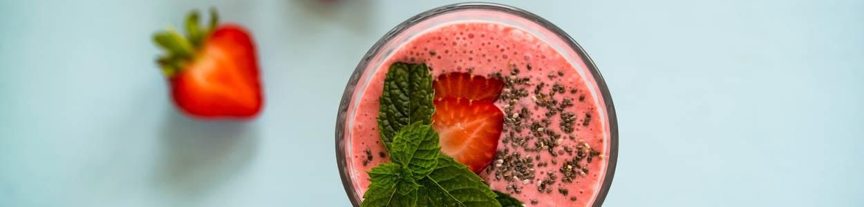 Fresh strawberry smoothie served in a glass, perfect for a juice retreat