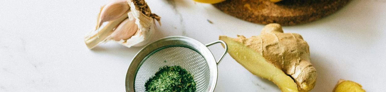 Fresh garlic, lemon, and ginger arranged as natural ingredients for immunity boost retreats