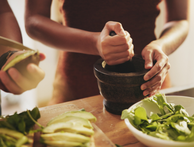 Woman preparing a healthy fresh meal at a health retreat