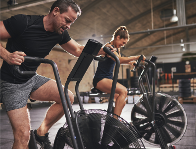 Woman training with a personal trainer at a fitness centre during an intensive weight loss holiday