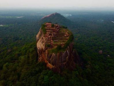 Large rock surrounded by lush forest at an Ayurveda retreat in Sri Lanka
