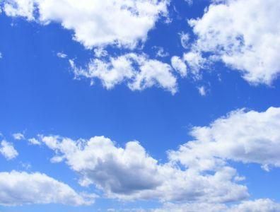 Blue sky with white clouds symbolising freedom and a fresh start at a quit smoking retreat