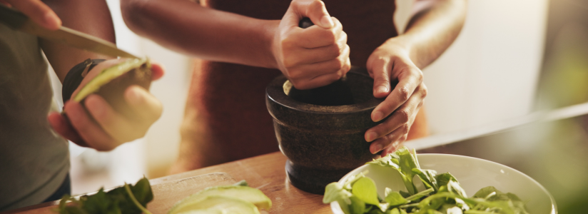 Woman preparing a healthy fresh meal at a health retreat