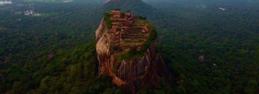 Large rock surrounded by lush forest at an Ayurveda retreat in Sri Lanka