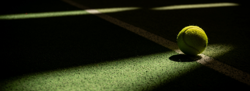 Tennis ball on a tennis court during a tennis holiday