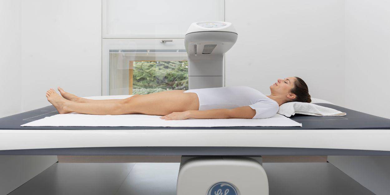 Female client doing the Dexa scanner 