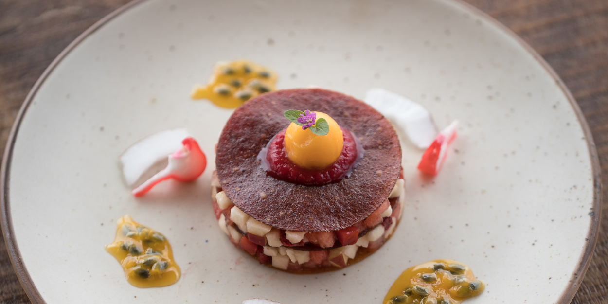 Plate with a stack of healthy looking colourful vegetables