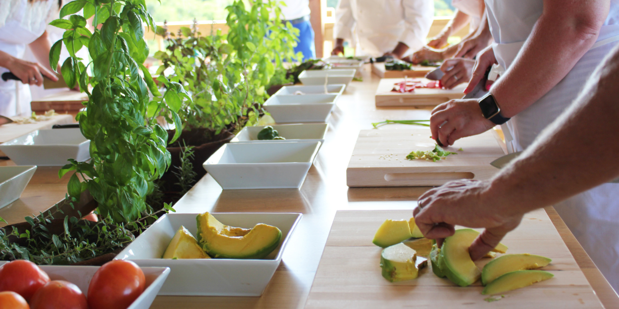 Group healthy cooking class preparing nutritious meals together.