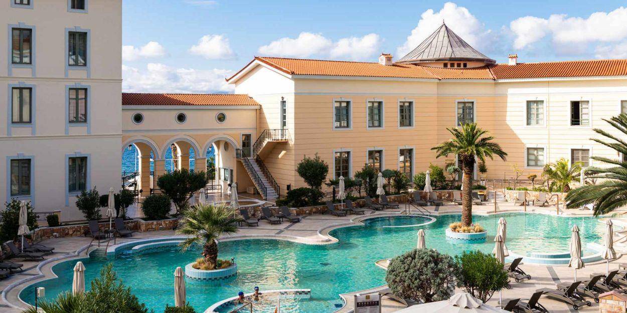 Swimming pool with jets under a cloudy sky