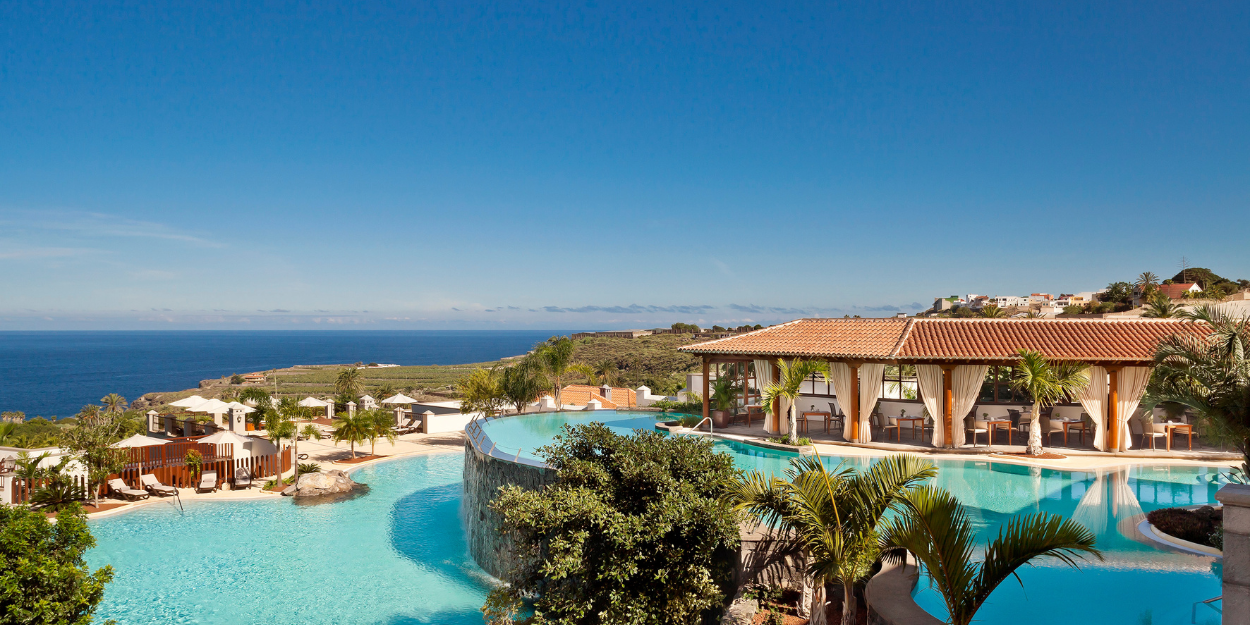 Infinity-style pools at Hacienda del Conde, Tenerife, with stunning views of the Atlantic Ocean and surrounding coastal landscape
