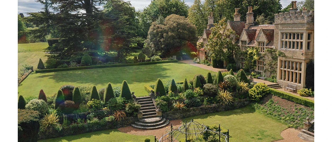 Traditional manor house in landscaped grounds 