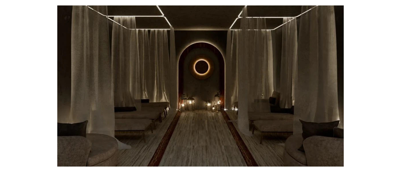 Moodily-lit relaxation room with cream-cushioned daybeds, sheer white curtains, and a group of lanterns