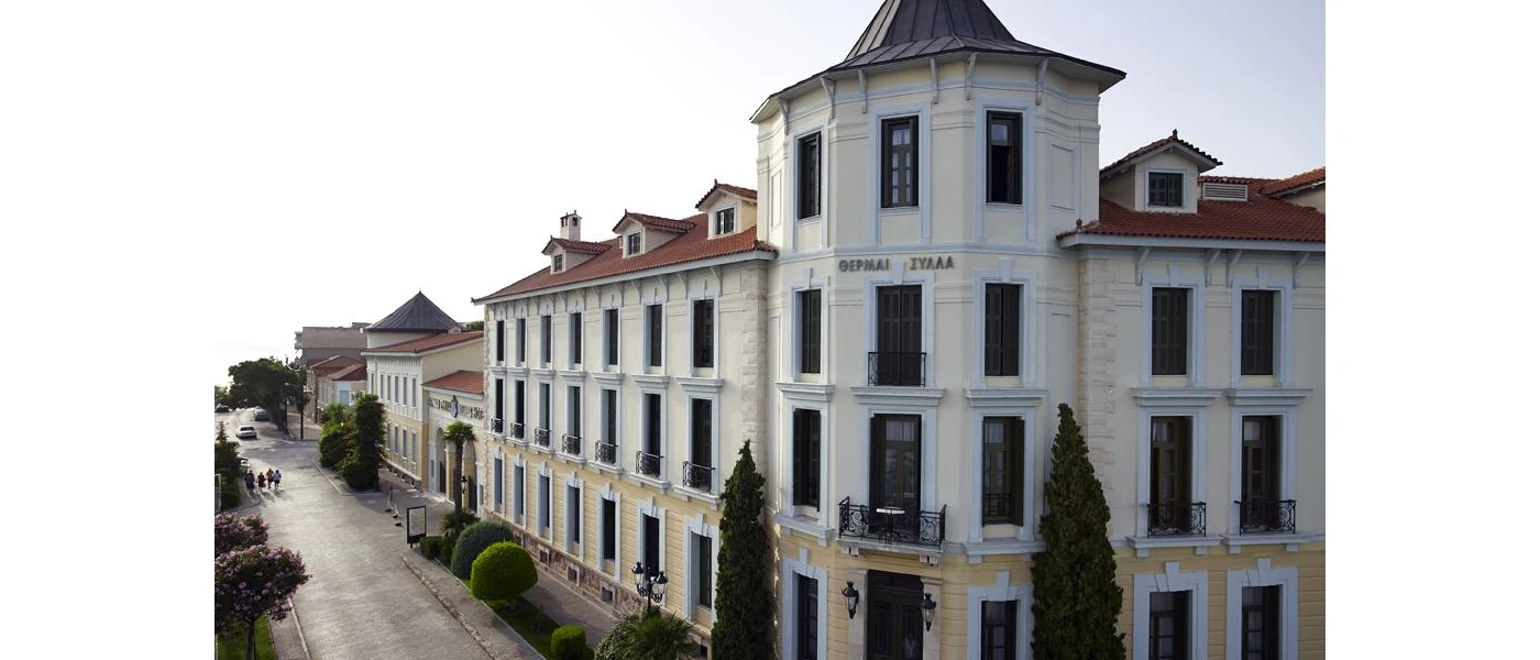 White hotel exterior with terracotta rooftops