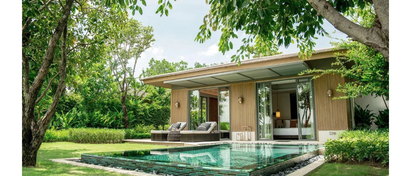 Villa with wood-panelled walls, a garden and private pool