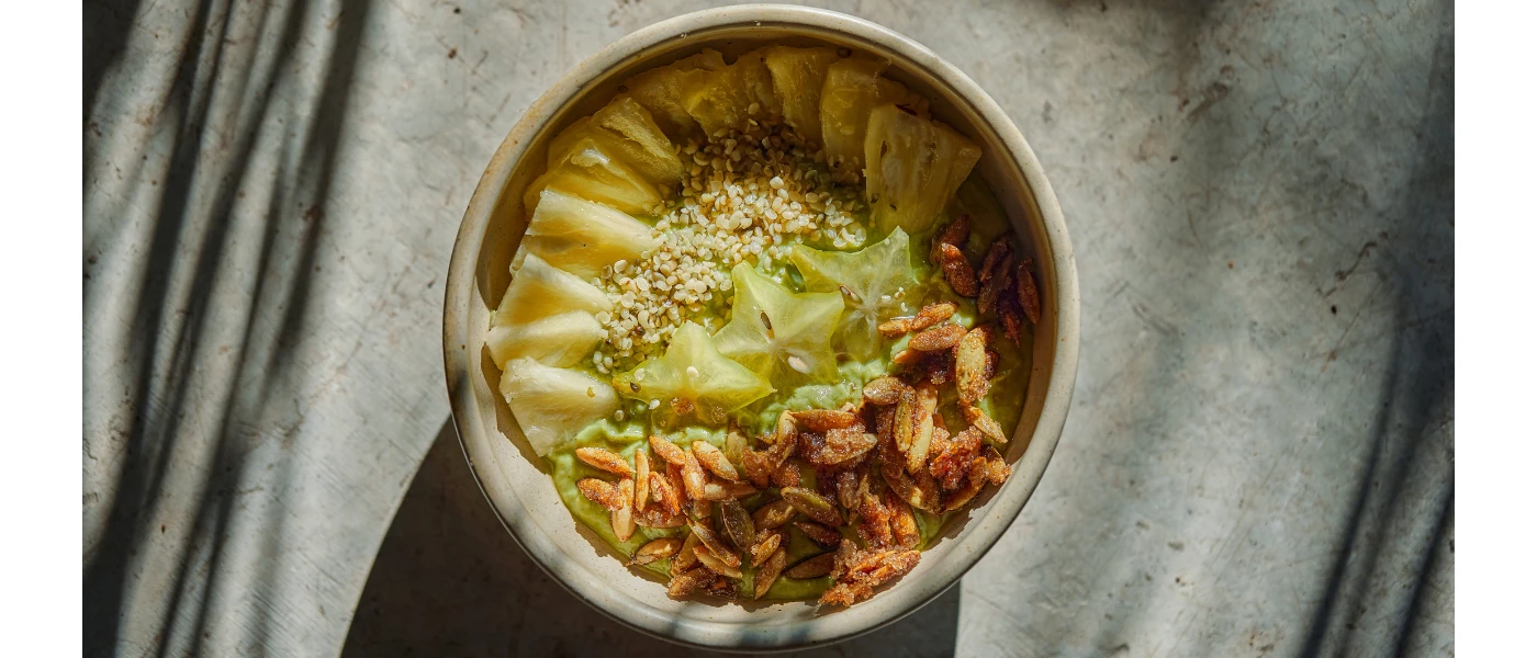 Healthy looking salad bowl with nuts, grains and star-shaped green veg