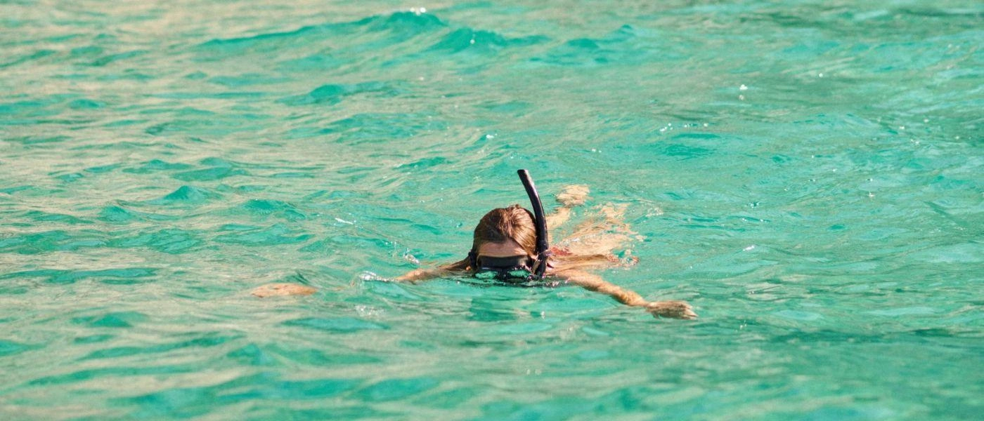 Female snorkels in the Mediterranean Sea 