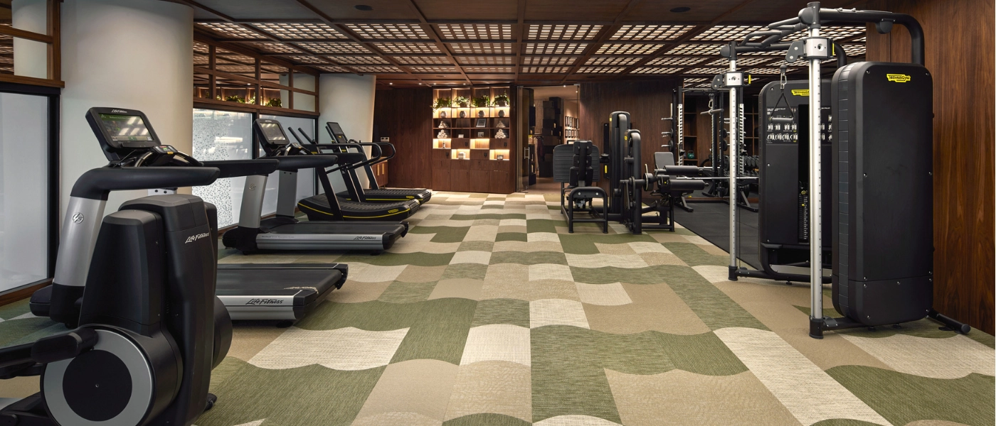 Gym room with various fitness machines and tools 