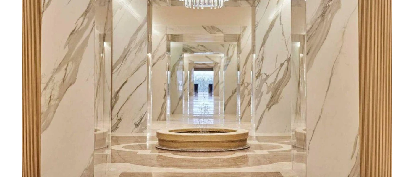 Marble walls and pillars with a central water feature 