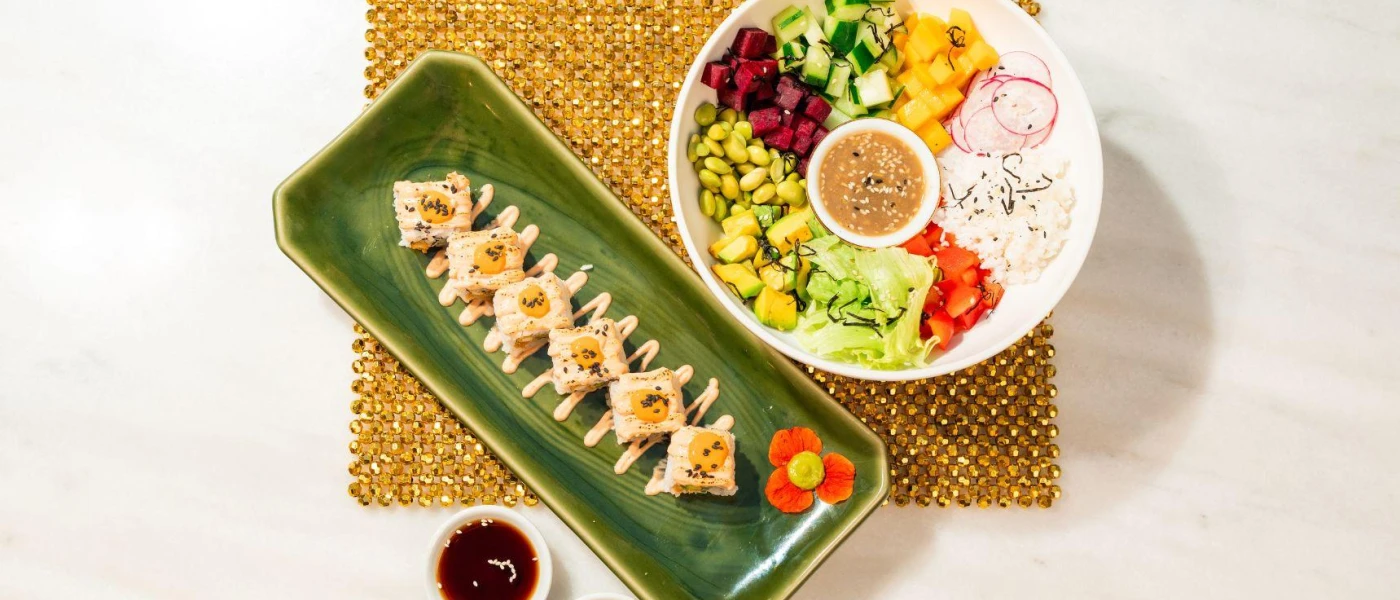 Fresh salad and small bites laid out in colourful patterns 