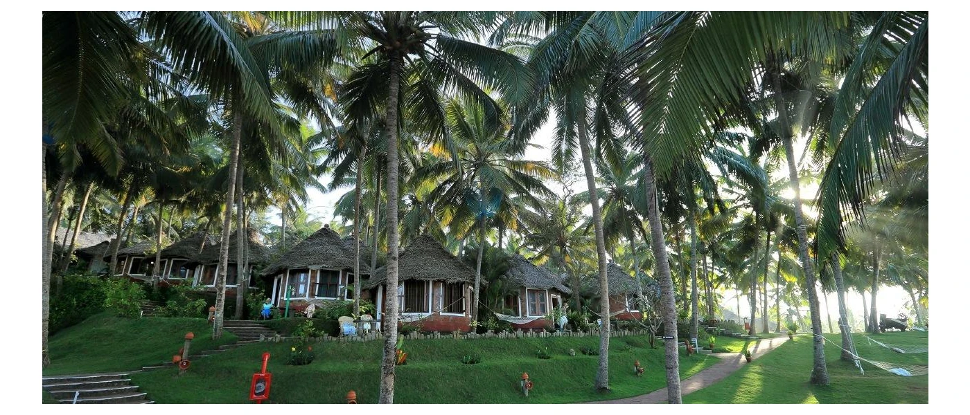 Gardens of coconut palms filled with thatched-roof huts, hammocks and lawn-lined pathways