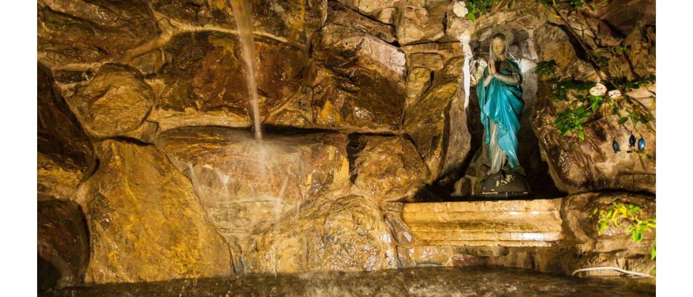 Chapel with religious statue with cobbled stone walls