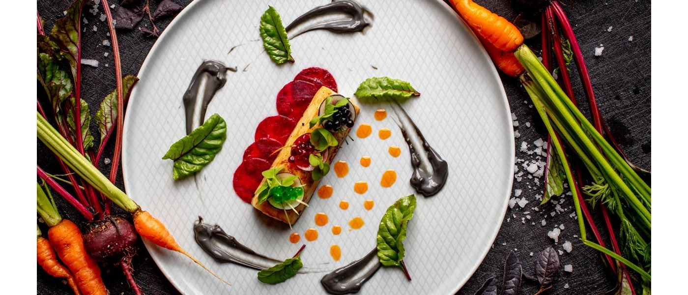 Healthy looking, intricately laid out food on a white plate 