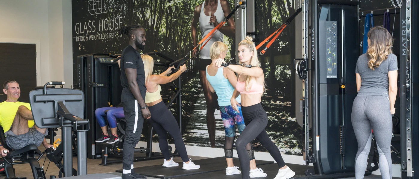 Group of women working out with instructor in a gym