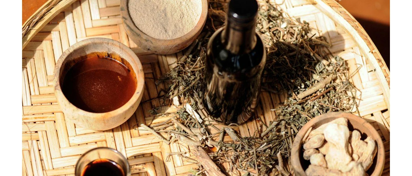 Wooden tray with pots of oils and spices and herbs