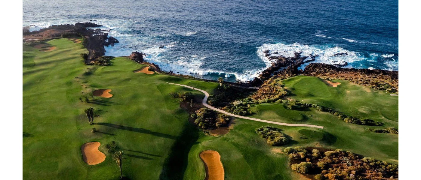 Stunning aerial view of the golf course with sea at distance