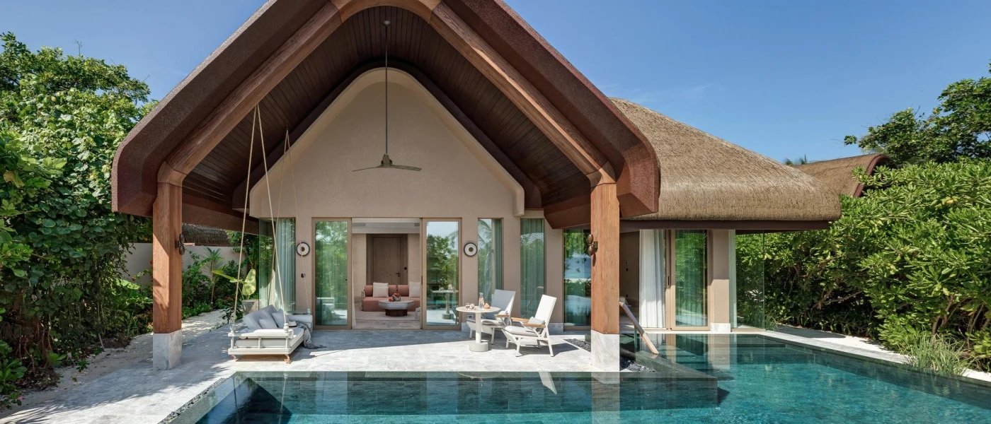 Thatched-roof villa with a large furnished terrace, a private pool and surrounding greenery