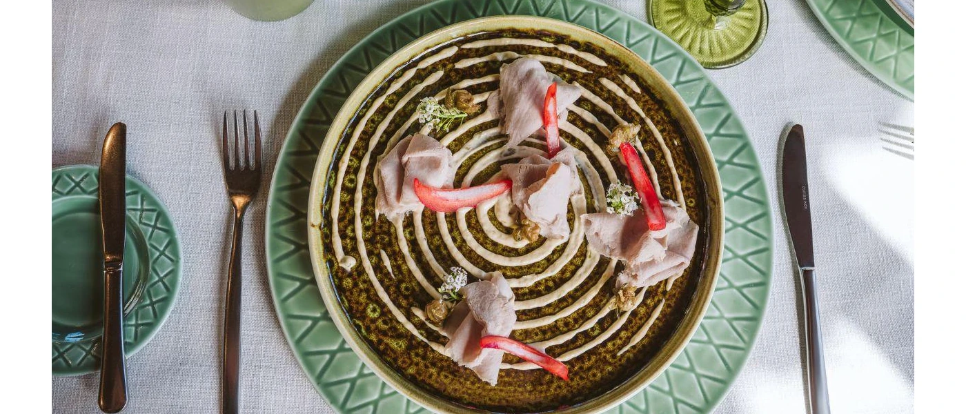 Beautifully presented food laid out on a white tablecloth