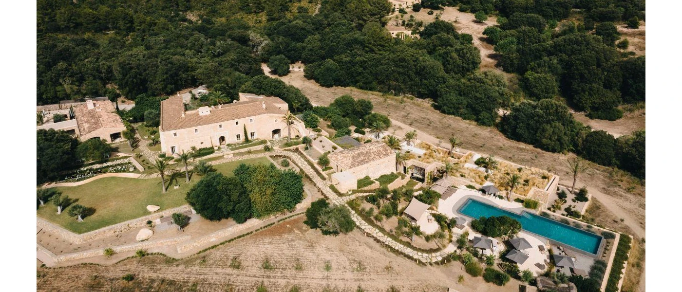 Es Raco d’Arta seen from above, including surrounding greenery and swimming pool