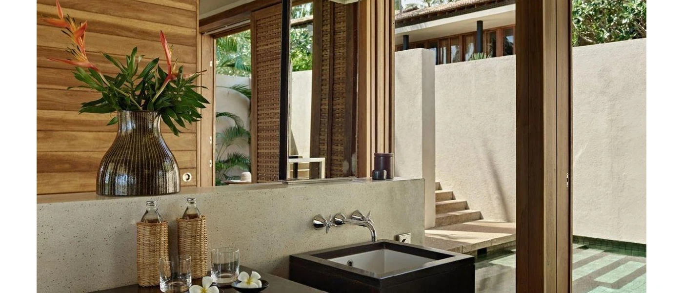 Smart, wood-panelled room with floor-to-ceiling windows, a black sink and a 