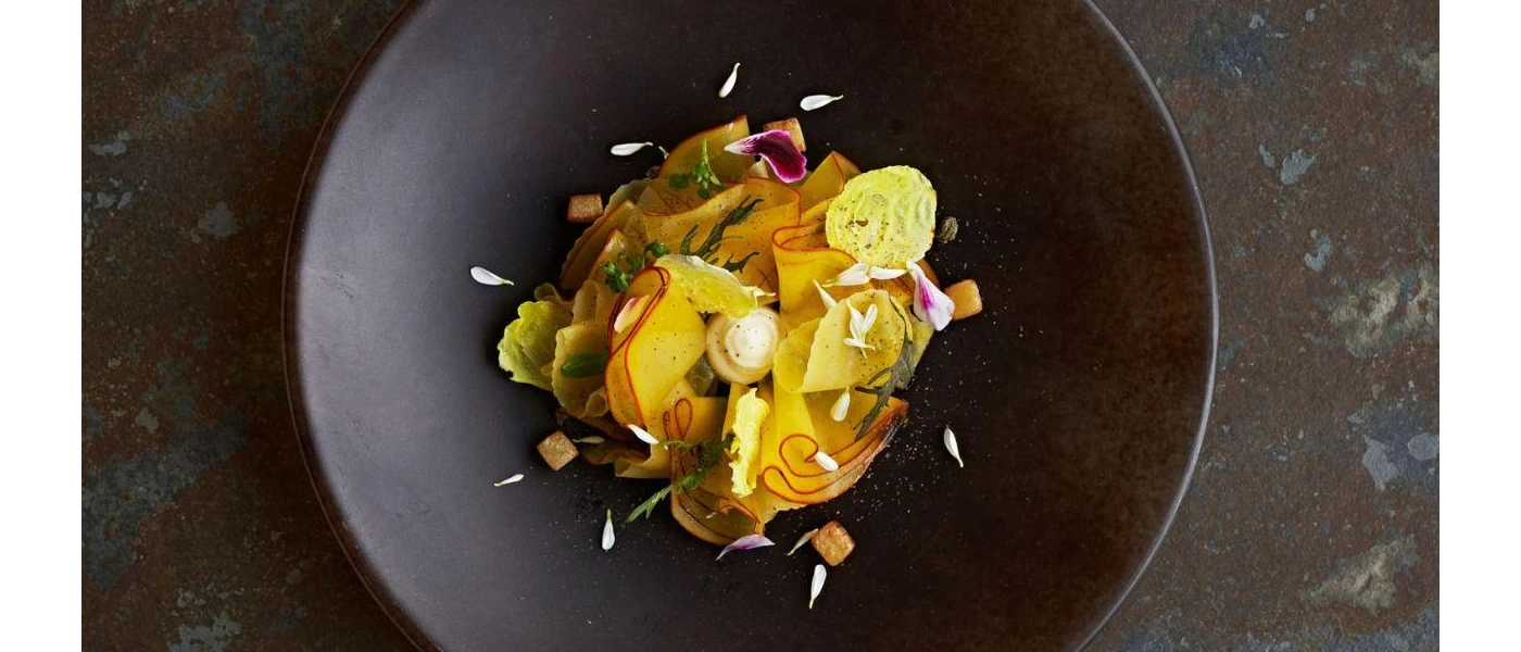Delicate, healthy looking food in a black bowl