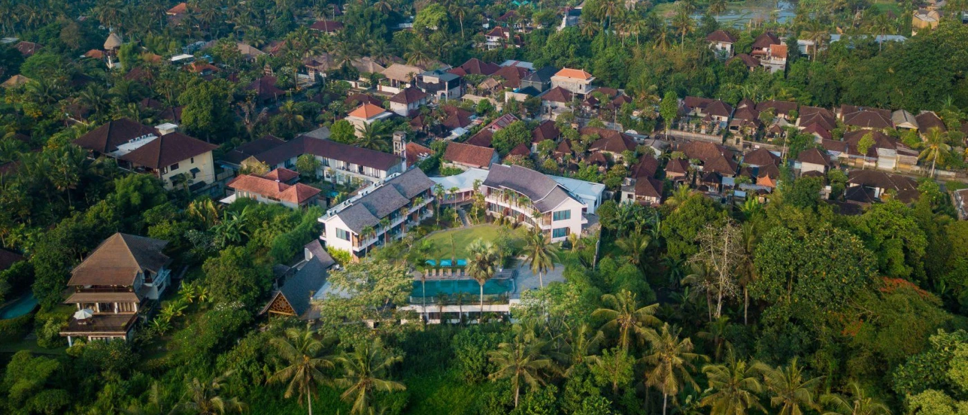 Aerial view of Rudra Sahashrara rooftops and pool, tucked among tropical gardens