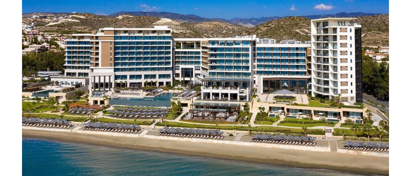 AMARA hotel from the front, showing the ocean and landscaped grounds