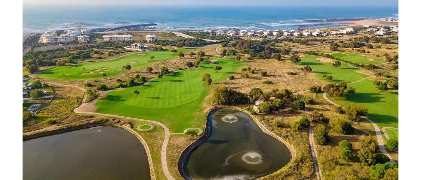Aerial view of golf course and beach and Atlantic Ocean 