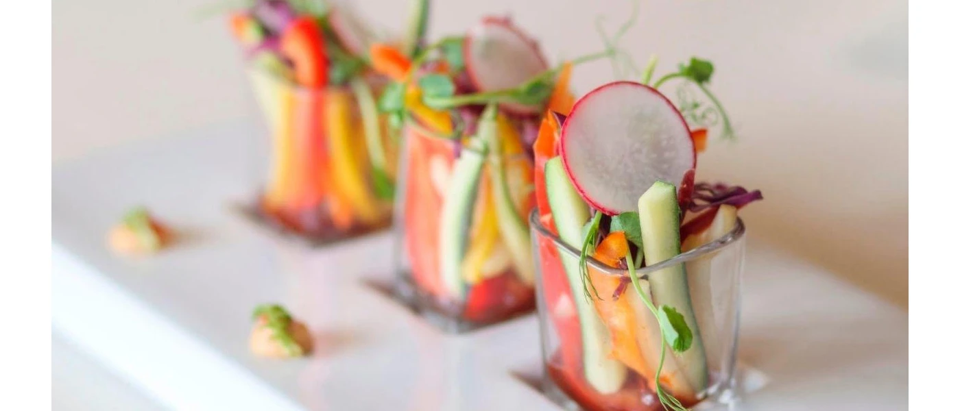Beautifully presented vegetables in three small glasses