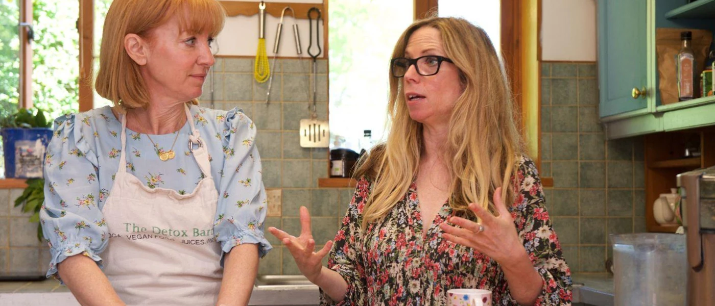 The Gavin sisters - hosts of The Detox Algarve, talking in a kitchen