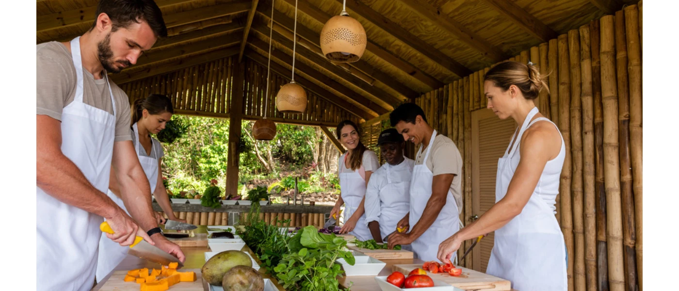Group enjoying a hands-on healthy cooking class preparing fresh ingredients.