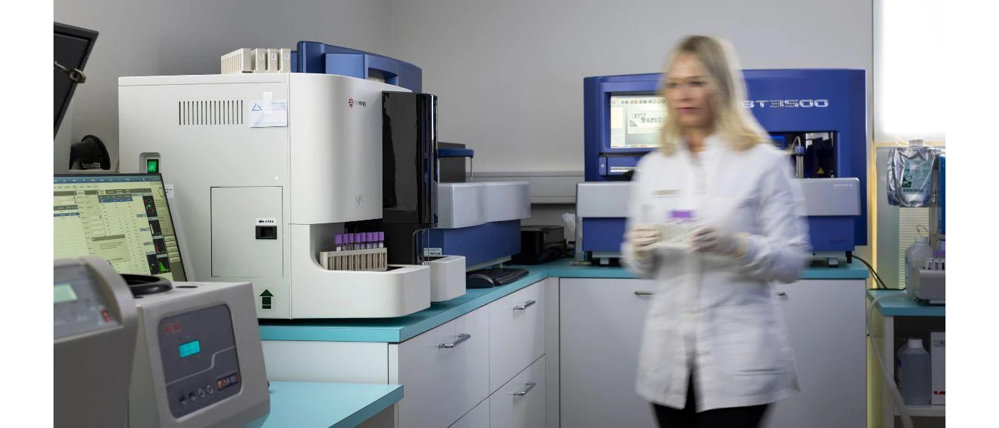 A female laboratory assistant doing tests in Palace Merano medical laboratory 