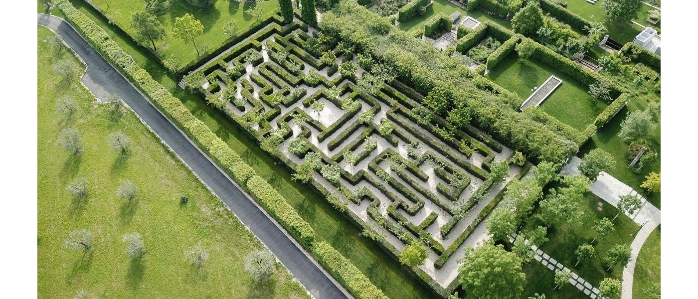 Labyrinth surrounded by manicured grounds in the sunshine  