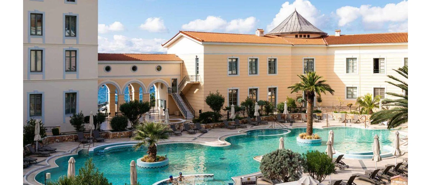 Swimming pool with jets under a cloudy sky