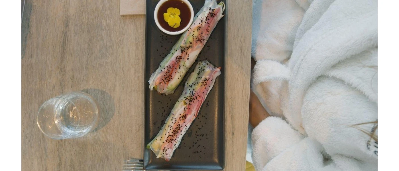 Beautifully presented food on a black tray