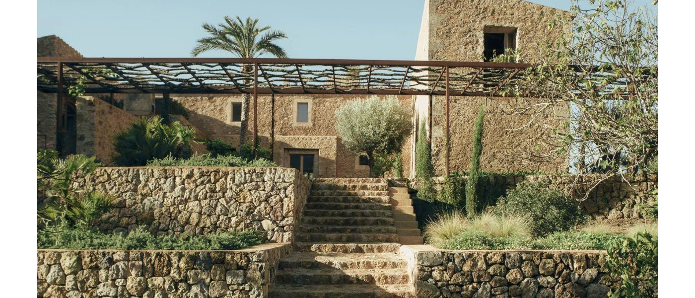 Traditional farmhouse exterior in a green garden