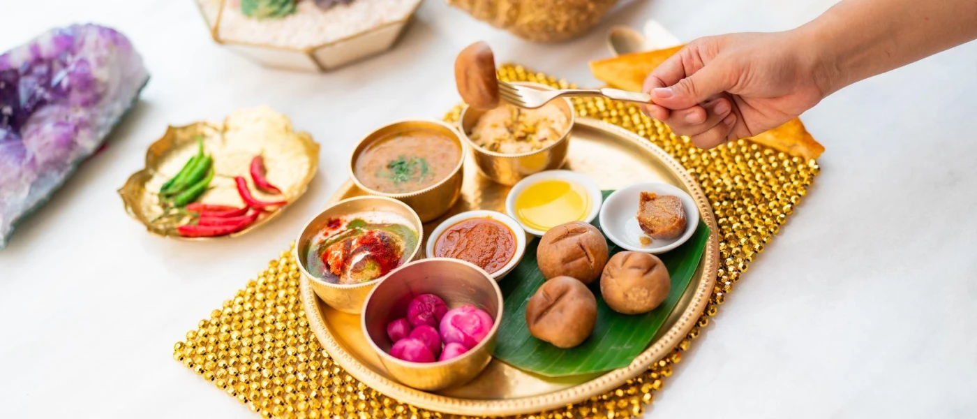 Colourful, nutritious food and sauces laid out on plates