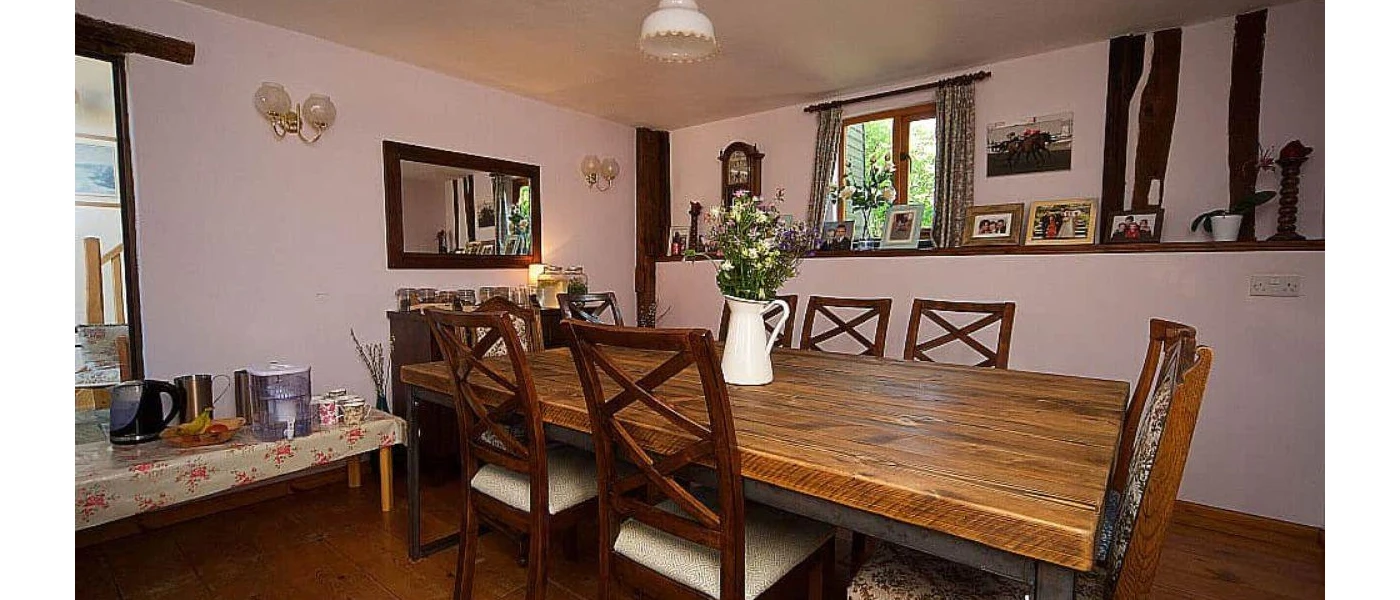 Traditional farmhouse-style dining room with wooden furnishings