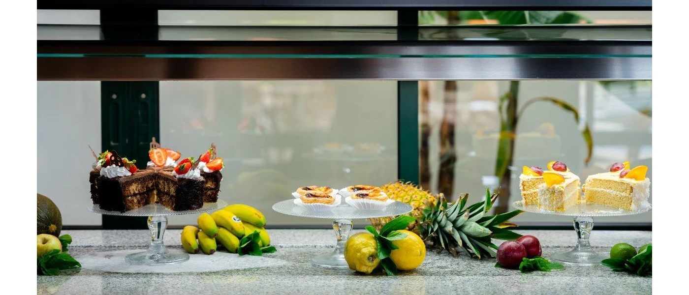 Dessert selection of fresh fruit, sponge and chocolate cakes and tarts