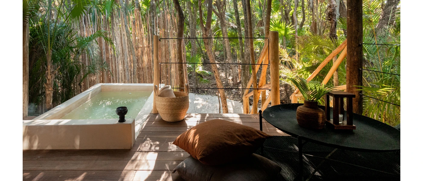Wooden deck in jungle greenery with a private plunge pool 