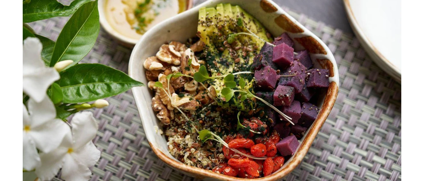 Salad bowl with beetroot, avocado, tomatoes, grains and walnuts